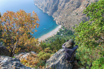 The tourist looks at the valley of the butterflies from hill. Turkey