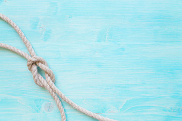 Marine rope on the background of blue boards