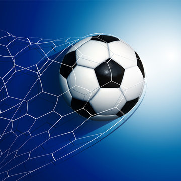 Football  soccer ball flying into the goal net