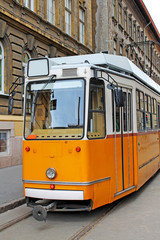 Naklejka na ściany i meble Yellow tram in Budapest, Hungary.
