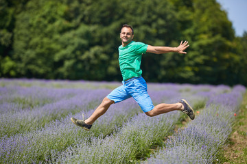 Happy farmer jumping for joy