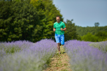 Happy farmer in his lavender field