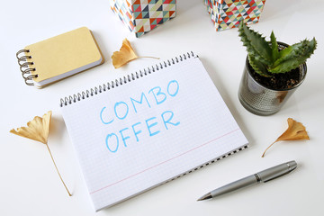 combo offer written in a notebook on white table