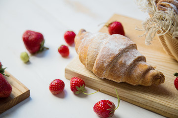 Breakfast croissants with fresh raspberries morning concept