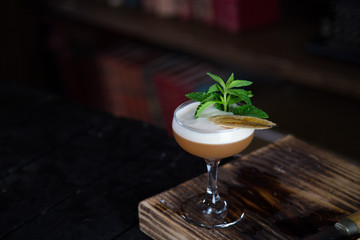 a refreshing cocktail in a tall glass in a bar