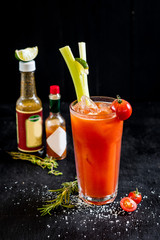 Spicy red cocktail Bloody Mery on black background