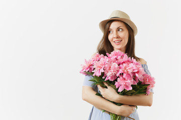 Young tender woman in blue dress, hat holding bouquet of beautiful pink peonies flowers isolated on white background. St. Valentine's Day, International Women's Day holiday concept. Advertising area.