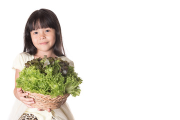 beautiful little girl with vegetables on a white background