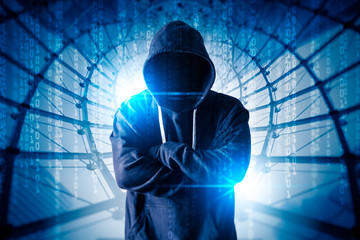 The abstract image of the hacker standing behind binary code and the cityscape is backdrop. the concept of cyber attack, virus, malware, illegally and cyber security.
