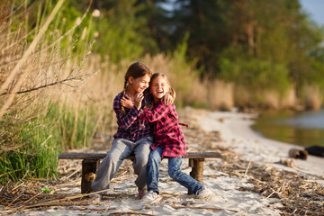 Two girls playing on the beach