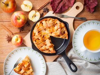 Homemade apple pie  pastry serve with hot tea on wooden table in topview,bakery and dessert concept.