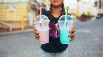 girl Showing Bubble Teas At city background