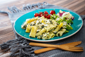 tasty pasta Rigatoni with Spinach and Goat Cheese