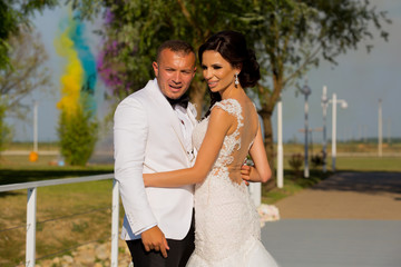 New line wedding couple posing in park