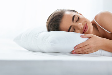 Pillows. Woman Resting On White Pillow Sleeping In Bed