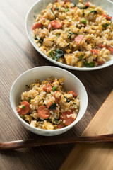 Fried rice with egg and wood grain background