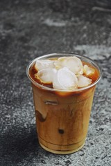 Iced latte to go on the dark backgroind. Iced coffee isolated 