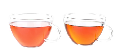 Two cups of hot aromatic tea on white background