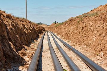 Pipelines laid on sand filling at the bottom of trench