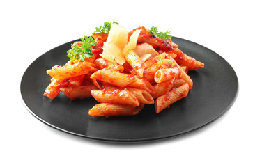 Plate with delicious penne pasta and sauce on white background