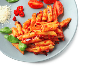 Plate with delicious penne pasta and garnish on white background