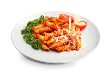 Plate with delicious penne pasta and garnish on white background