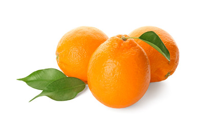 Tasty ripe oranges on white background