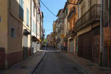 Fototapeta na wymiar A street in Arab quarter of Perpignan in the center of the city, France
