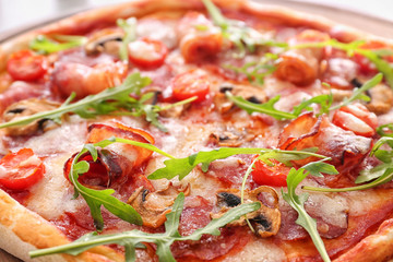 Tasty pizza with fresh arugula, closeup
