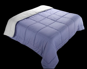 light blue quilt laid down on a double bed shape. isolated on black background