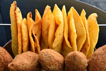 Traditional  plain snacks, fried on deep oil, for buying in streets in of Dominican Republic - obrazy, fototapety, plakaty