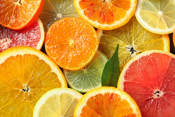 Slices of ripe citrus fruits as background