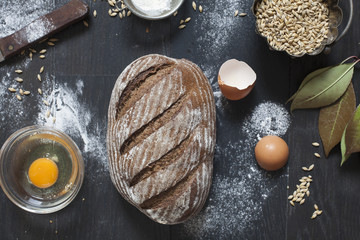 Top view of gluten free bread on dark wooden table.