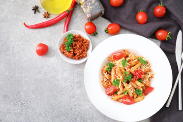 Composition with tasty penne pasta on table