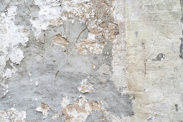 Old damaged wall of stones and concrete as background
