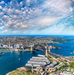 Helicopter view of Sydney Harbor Bridge and city skyline, Australia