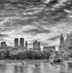 Central Park lake with reflections in foliage season, Manhattan, New York City