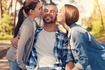 Absolute happiness. Delighted positive cheerful man closing his eyes and feeling happy while being kissed