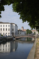 Fototapeta na wymiar Treviso, Italy - May 29, 2018: View of the River Sile in Treviso