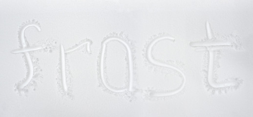 Obraz premium Hand written word frost drawing on fresh snow