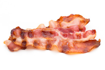 Cooked bacon rashers isolated on white.