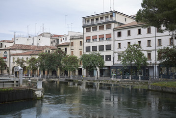 Fototapeta na wymiar Treviso, Italy - May 29, 2018: View of River Sile from san martino bridge