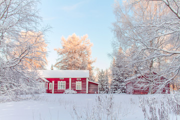 Old finnish building in winter scene. Kuhmo, Finland.
