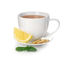 Cup of delicious tea with mint, lemon and ginger on white background