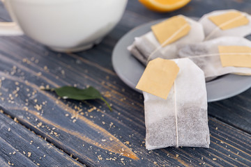 Tea bags on wooden background