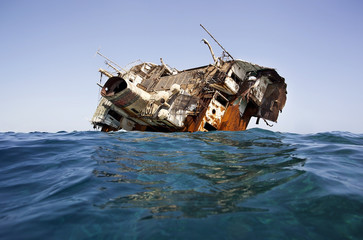 A large ship caught on the reefs in the red sea. Shipwreck.