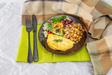 French Omelette with Potatoes, Mushroom and Salad