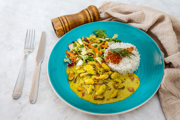 Mussels with curry sauce Rice and salad
