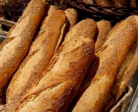 Crusty Loaves of Bastone Bread Grouped in a Large, Rustic Market Basket; Nutrition, Carbs, Food Choices, Farmers Market, Fresh Food