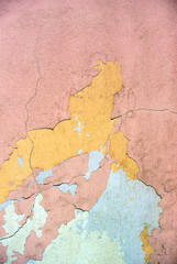 Close-up photo of the rough weathered colored stucco wall texture